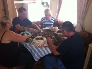 Committee members Gill Freeman, Tina Kingdom, Mike Rock, Bob Beer (having a break!) and helper Kevin Whitburn counting the coins in one of our luxury holiday homes at Sandy Bay.